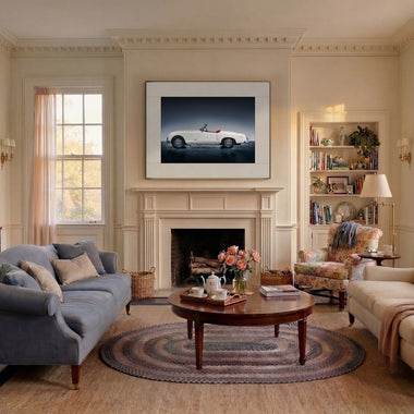 InkPoster color ePaper art display above a fireplace in a modern living room